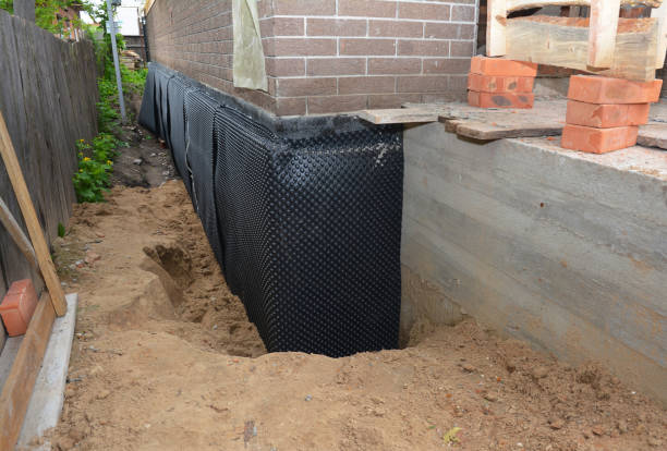 Happy homeowners after waterproofing job in Sumner